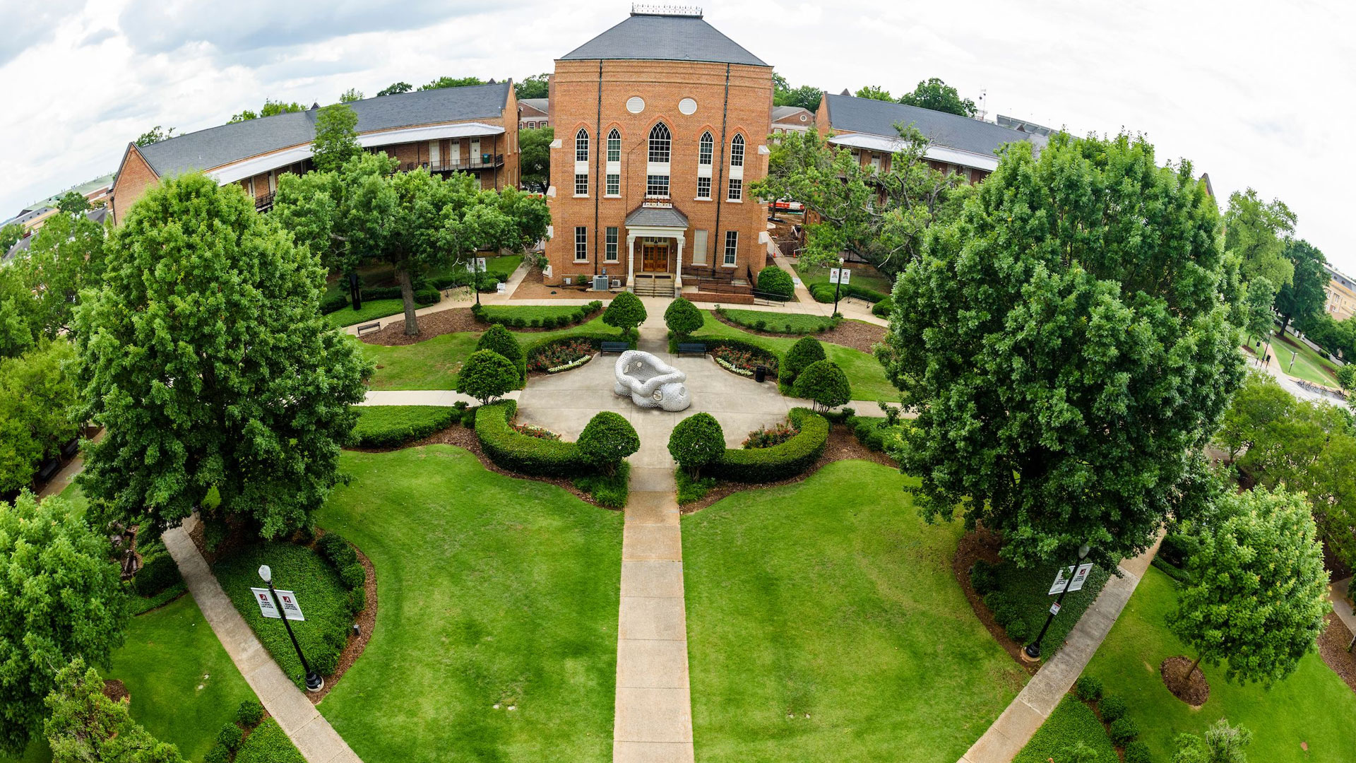 Lush campus with landscaped gardens.