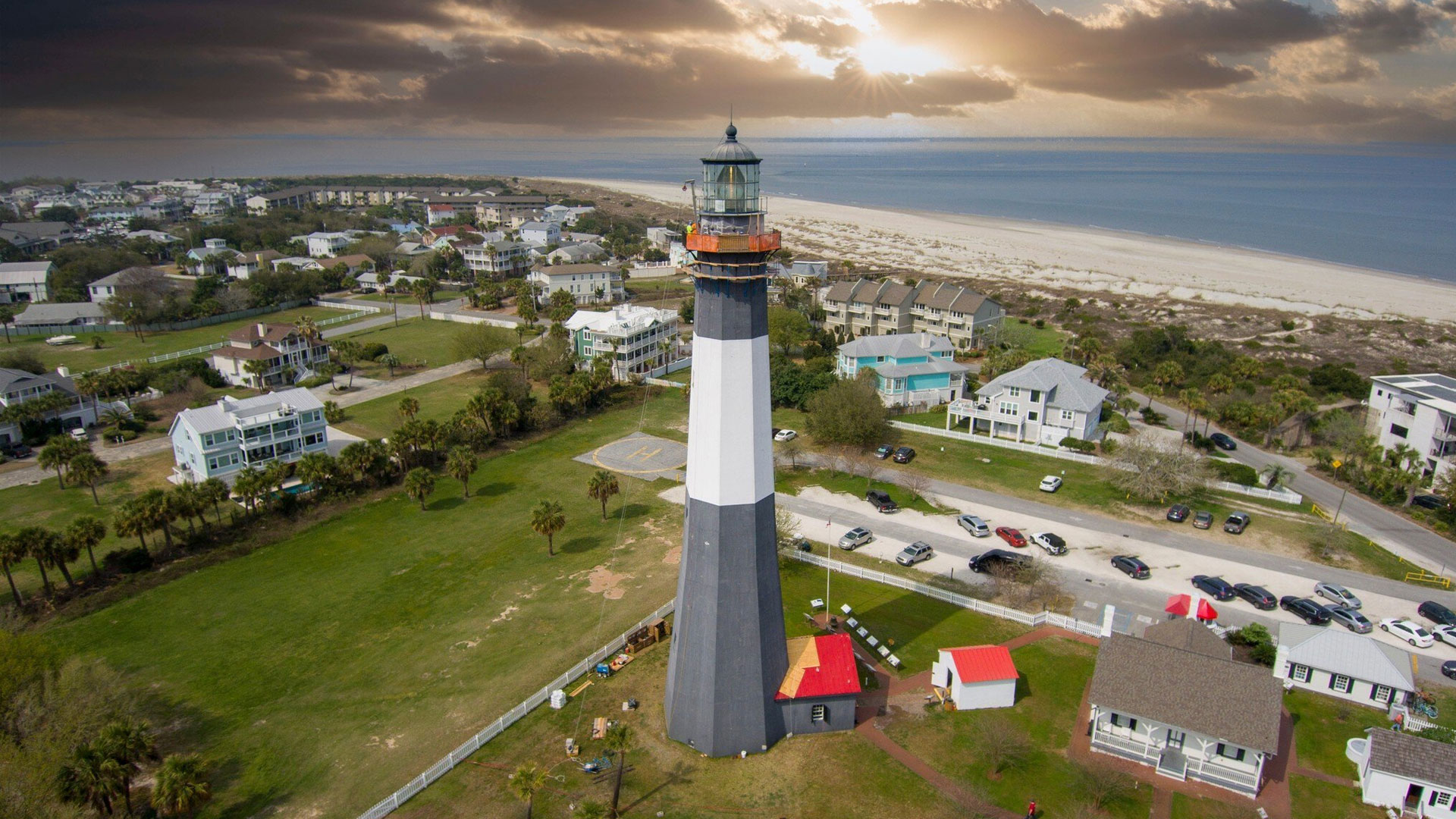 Lighthouse near coastal residential area