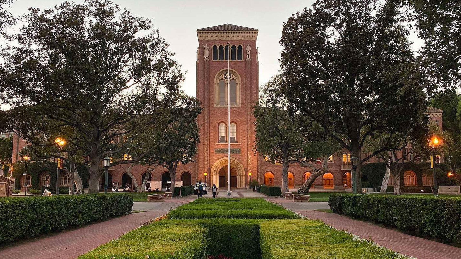 Historic building surrounded by greenery.